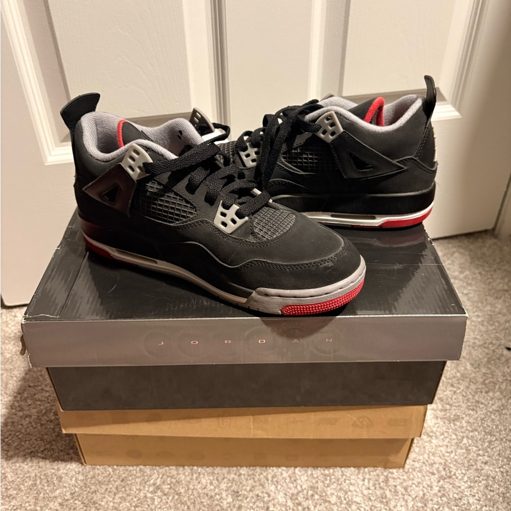 Jordan big kids Black and Gray Sneakers with Red Accents